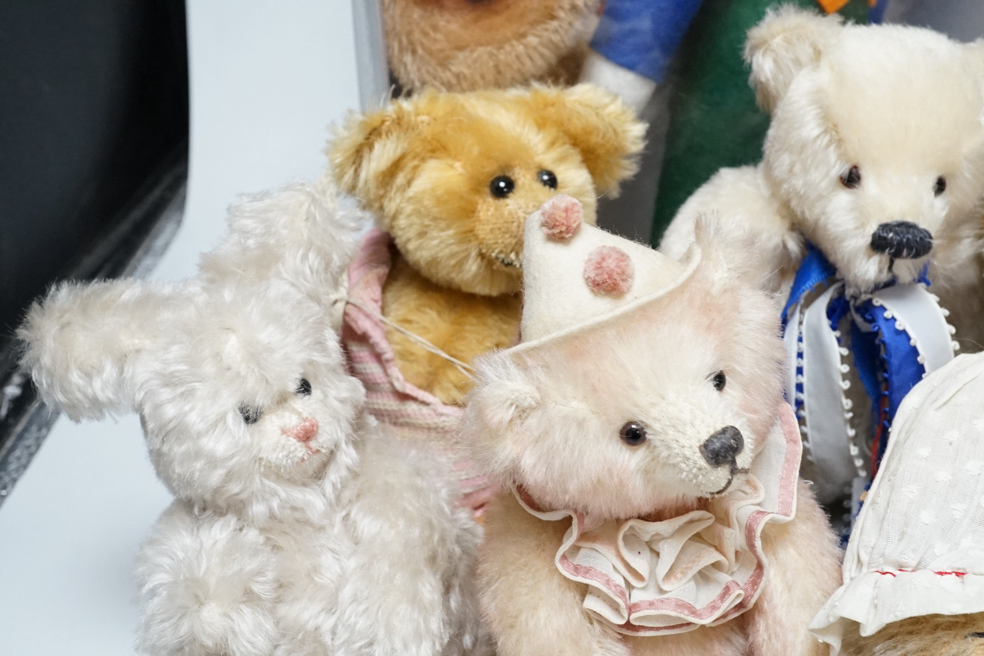 A Merrythought teddy and golly, boxed, with five artist's bears